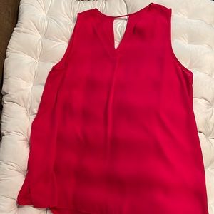 Hot pink sleeveless silky top. No brand and no size.